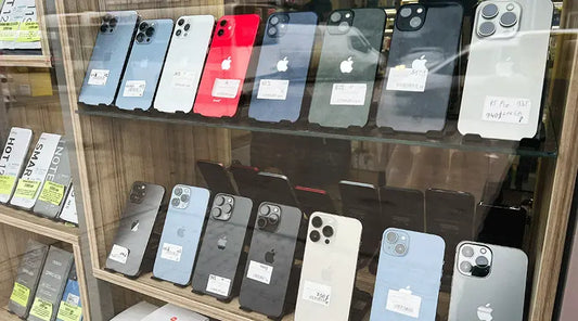 Smartphones being inspected for resale at PayMore Clinton.